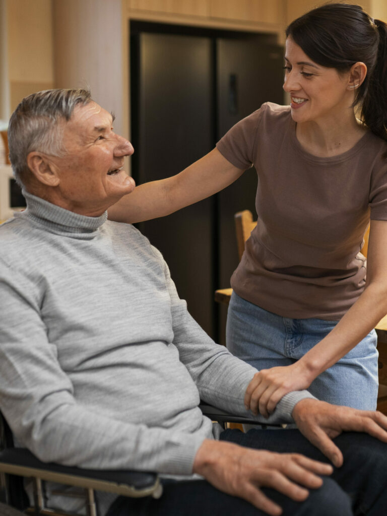 elderly-person-being-taken-care-by-female-caretaker